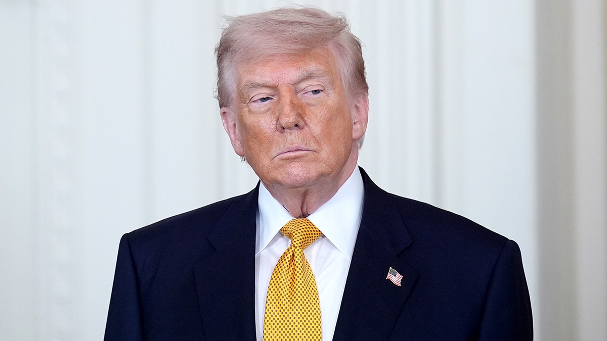 President Donald Trump speaking during a military Mother's Day event in the White House East Room