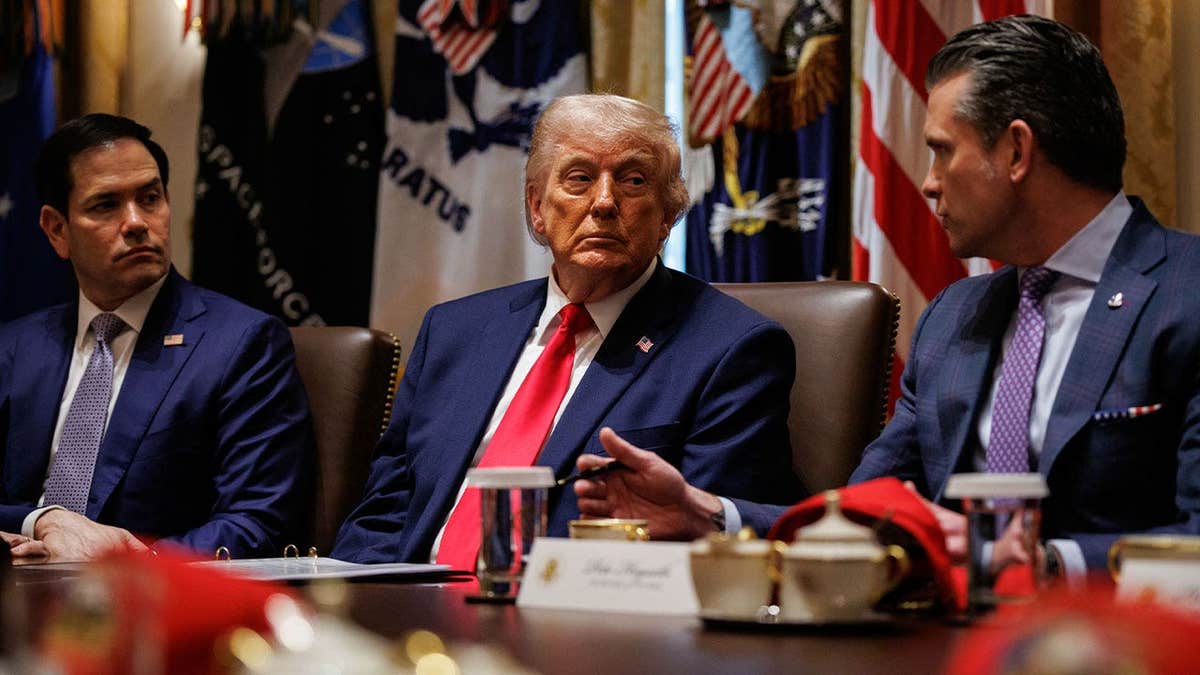 Donald Trump at a cabinet meeting alongside Marco Rubio and Pete Hegseth