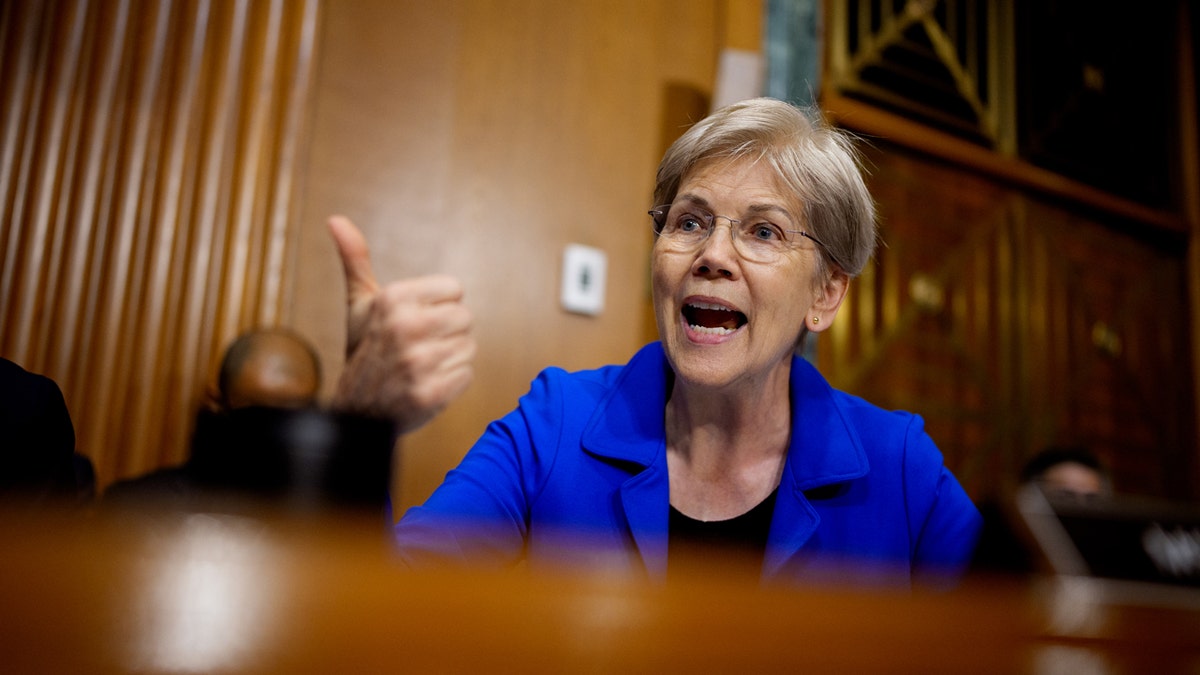 Sen. Elizabeth Warren speaking as Health and Human Services Secretary Robert Kennedy Jr. appears at a hearing