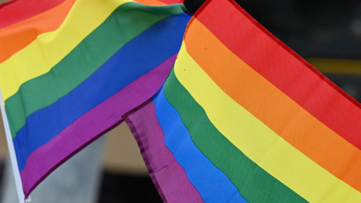 People holding pride flags at the LA Pride Parade in Hollywood