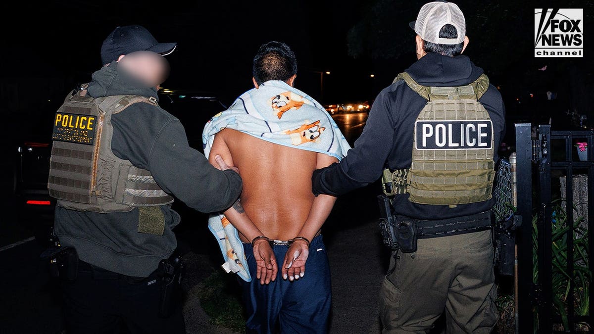 A man being arrested by ICE agents in Monassas, Virginia