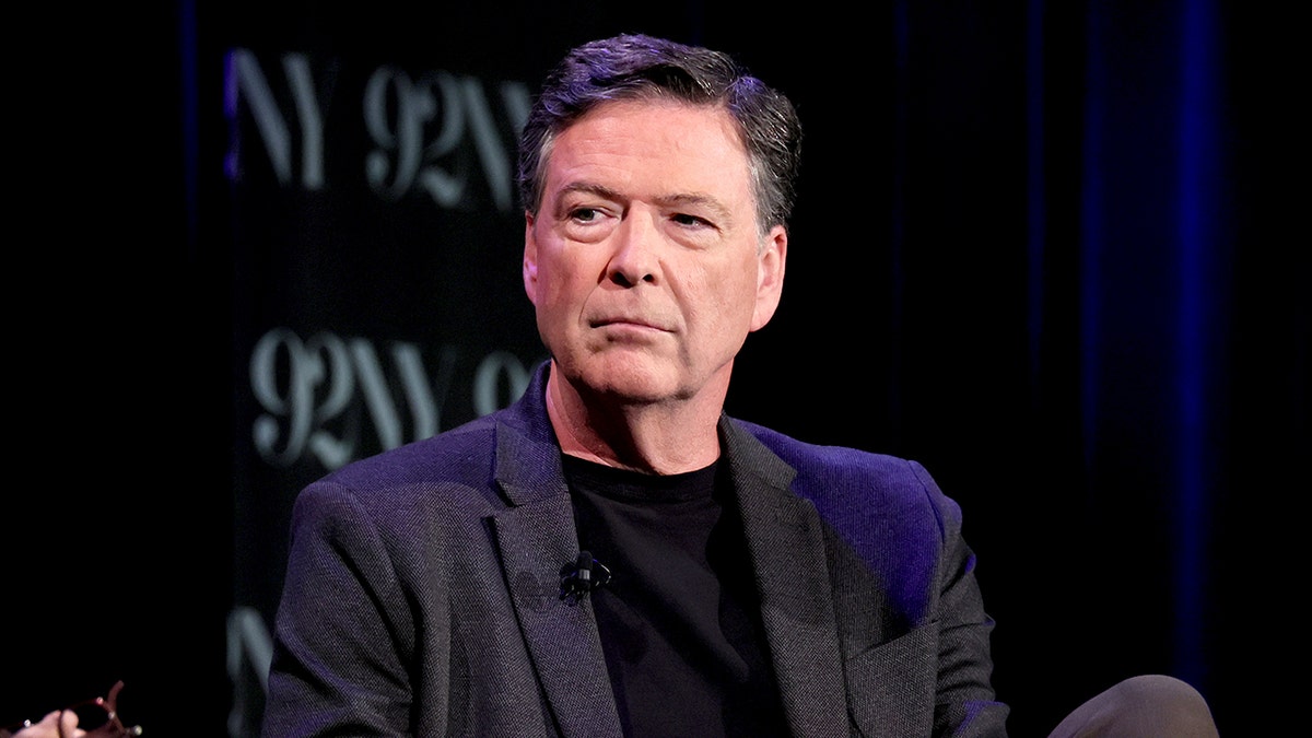 Former FBI Director James Comey standing at an event in New York City