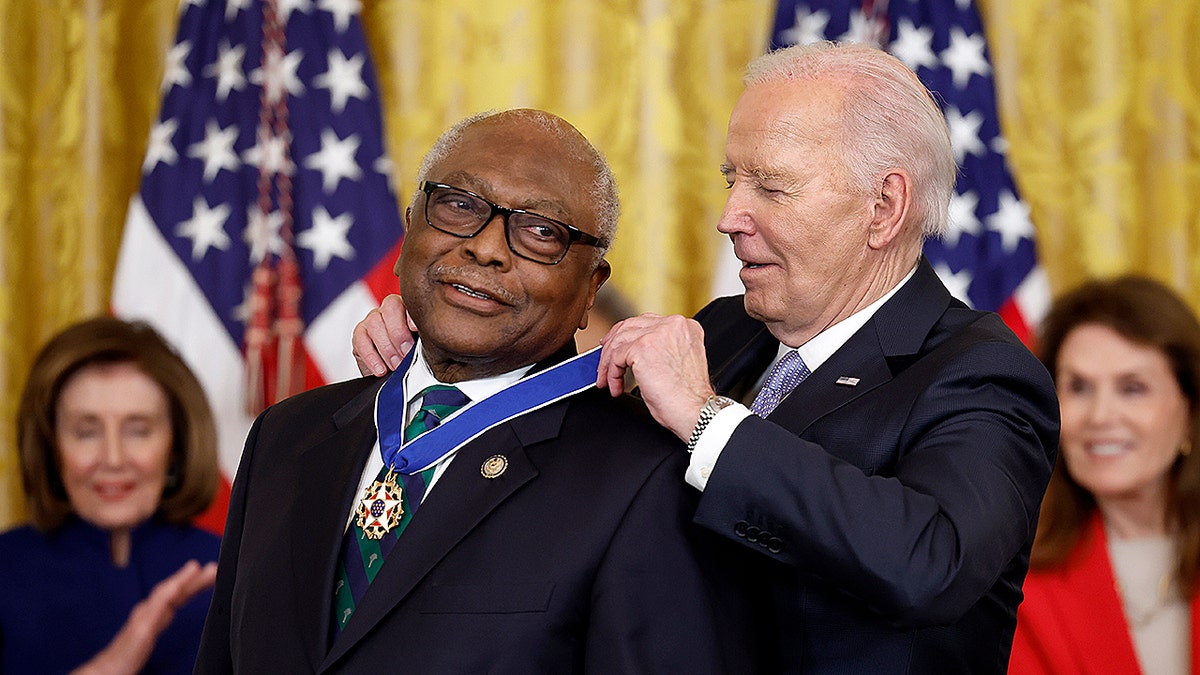 President Joe Biden awarding the Medal of Freedom to Rep. James Clyburn in the White House East Room