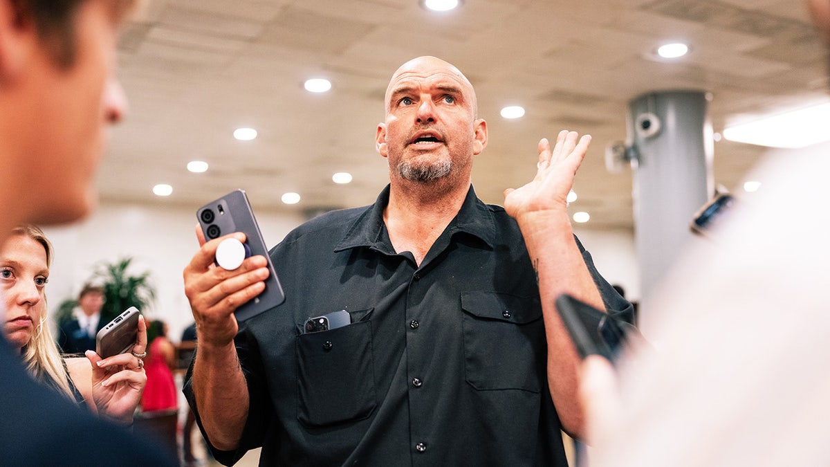 Sen. John Fetterman speaking to reporters at the US Capitol in Washington, D.C.
