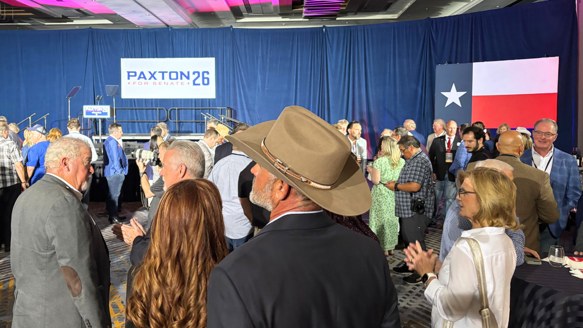 Guests at Ken Paxton’s election night watch party in Plano, Texas await incoming results on Tuesday, May 26, 2026.