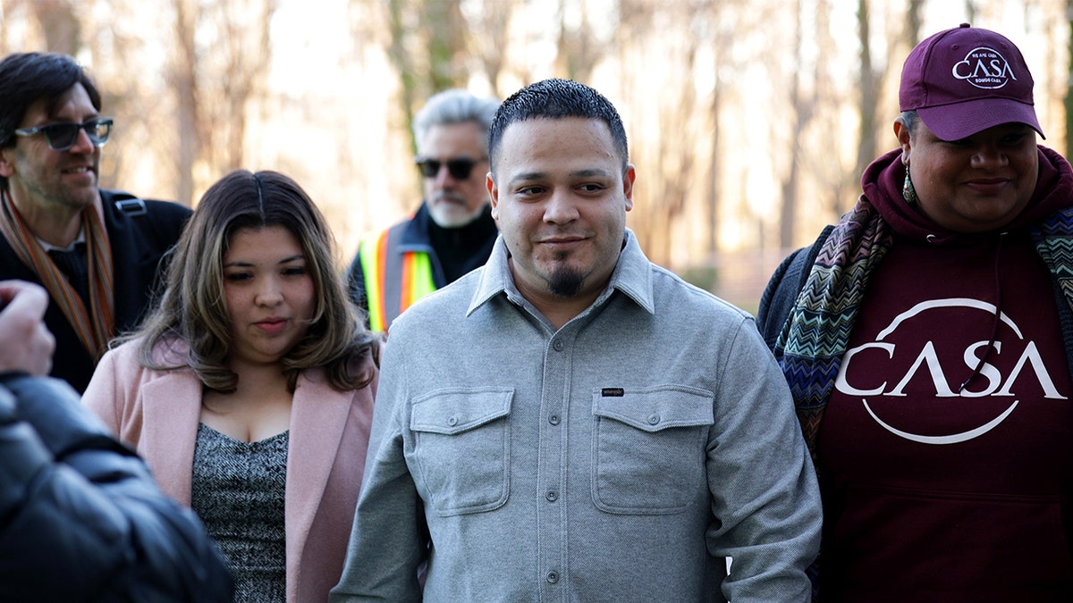 Kilmar Abrego Garcia walking with his wife Jennifer Vasquez Sura and attorney Simon Sandoval-Moshenberg outside U.S. District Court in Greenbelt Maryland