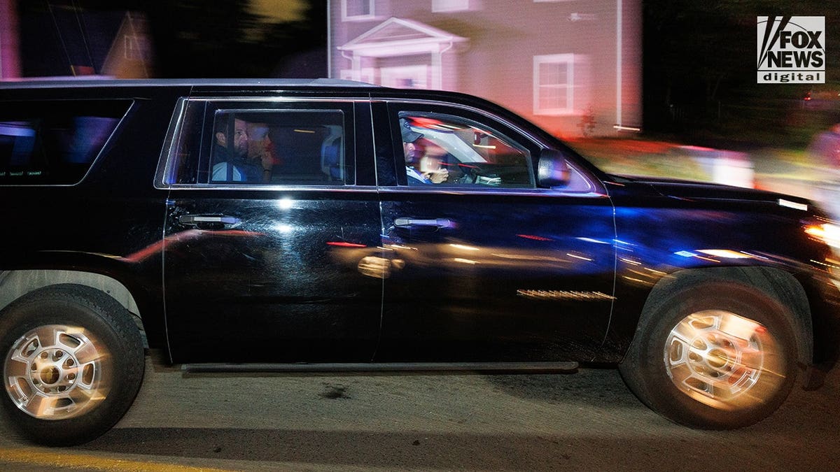 Secretary of Homeland Security Markwayne Mullin seated in a secure vehicle