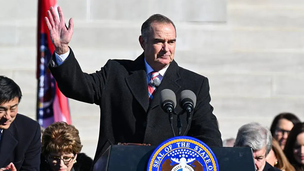 Missouri Gov. Mike Kehoe waving to crowd after being sworn in in Jefferson City
