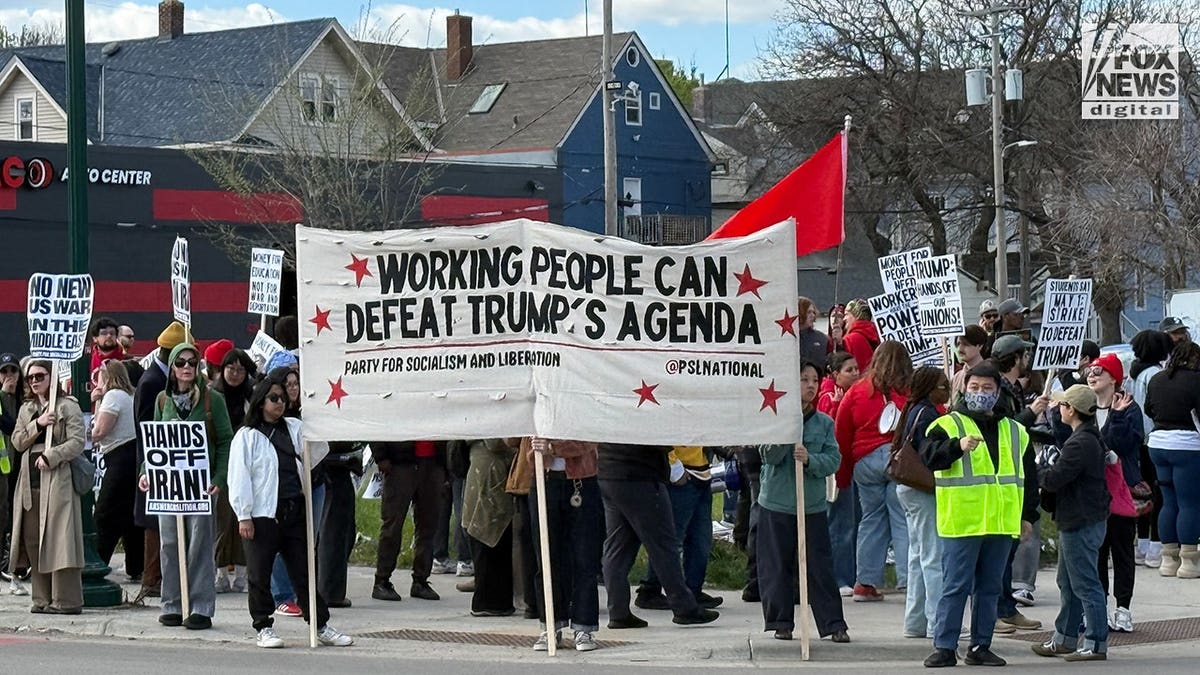 Revolutionary Communists of America banner carried by protesters at Minneapolis May Day rally