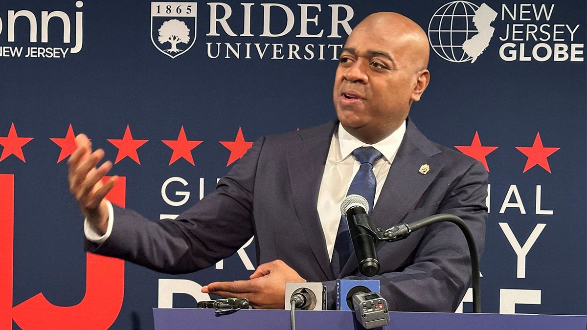 Newark Mayor Ras Baraka speaking at a podium after a debate at Rider University in Lawrenceville, New Jersey
