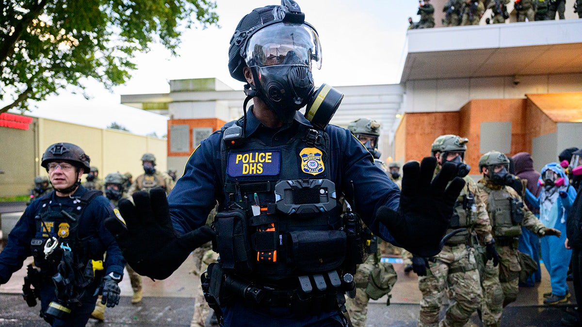 Federal agents clashing with anti-I.C.E. protesters outside U.S. Immigration and Customs Enforcement building in Portland