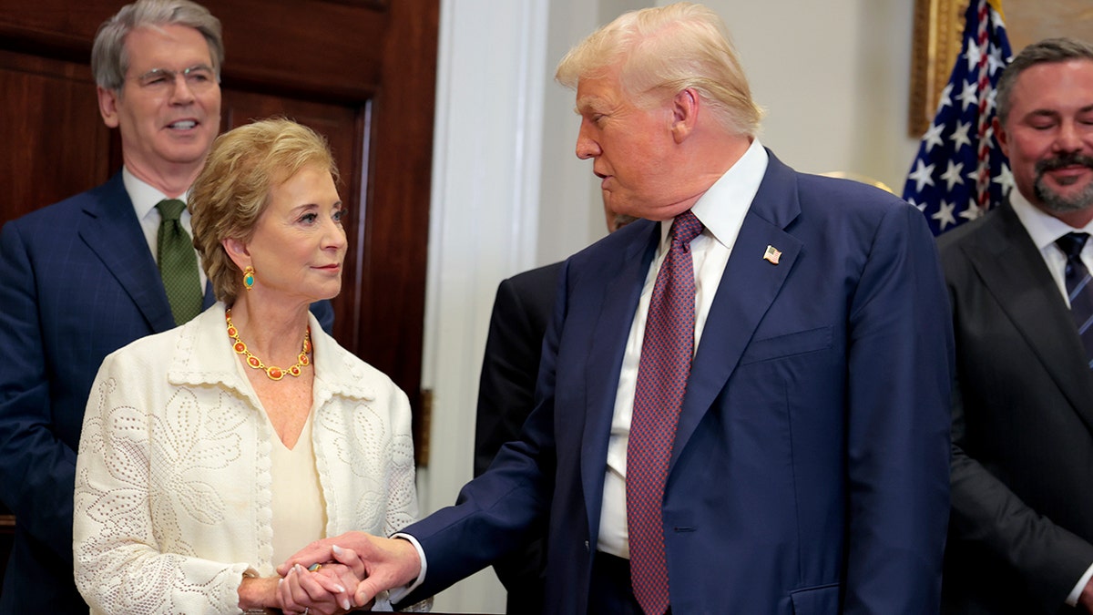 President Donald Trump speaking with Secretary of Education Linda McMahon in the White House Roosevelt Room