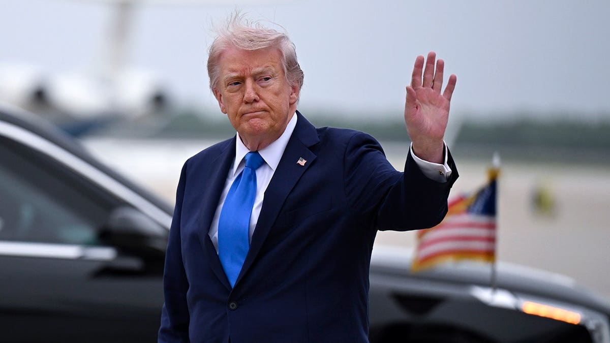 President Donald Trump waves