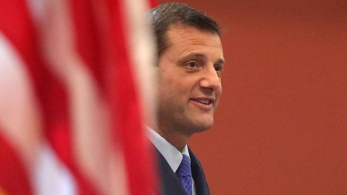 U.S. Rep. David Valadao standing at the Tulare City Council Chambers during a swearing-in ceremony