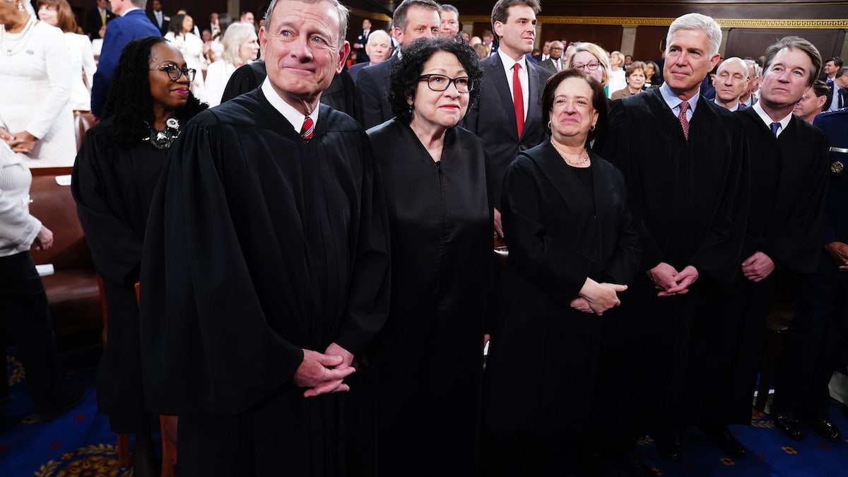 Chief Justice John Roberts and Associate Justices Sonia Sotomayor, Elena Kagan, Neil Gorsuch, Brett Kavanaugh standing on House floor