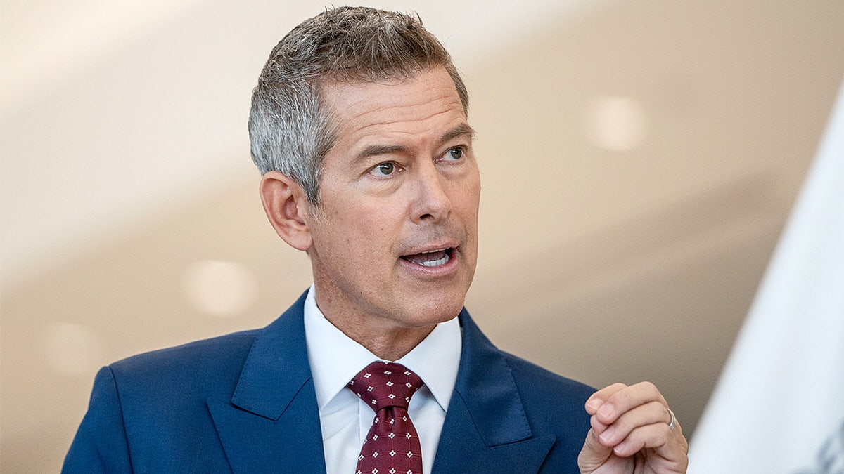 Secretary of Transportation Sean Duffy speaking during a news conference at Newark Liberty International Airport terminal