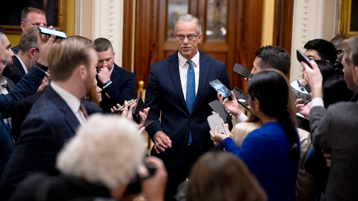 Senate Majority Leader John Thune speaking to media outside the Senate Chamber at the U.S. Capitol