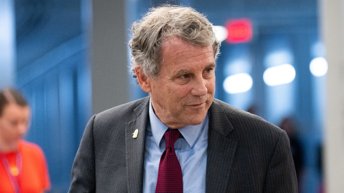 Sen. Sherrod Brown walking through the U.S. Capitol building.