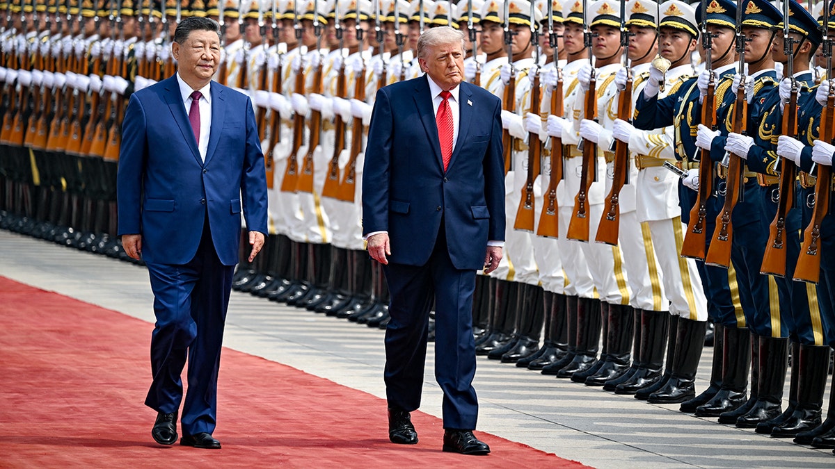 President Donald Trump and President Xi Jinping inspecting a guard of honour in Beijing