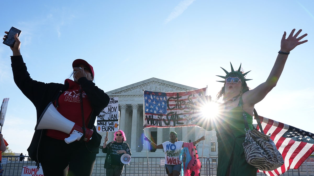 Pro and anti-Trump demonstrators rally outside the U.S. Supreme Court building in Washington, D.C.