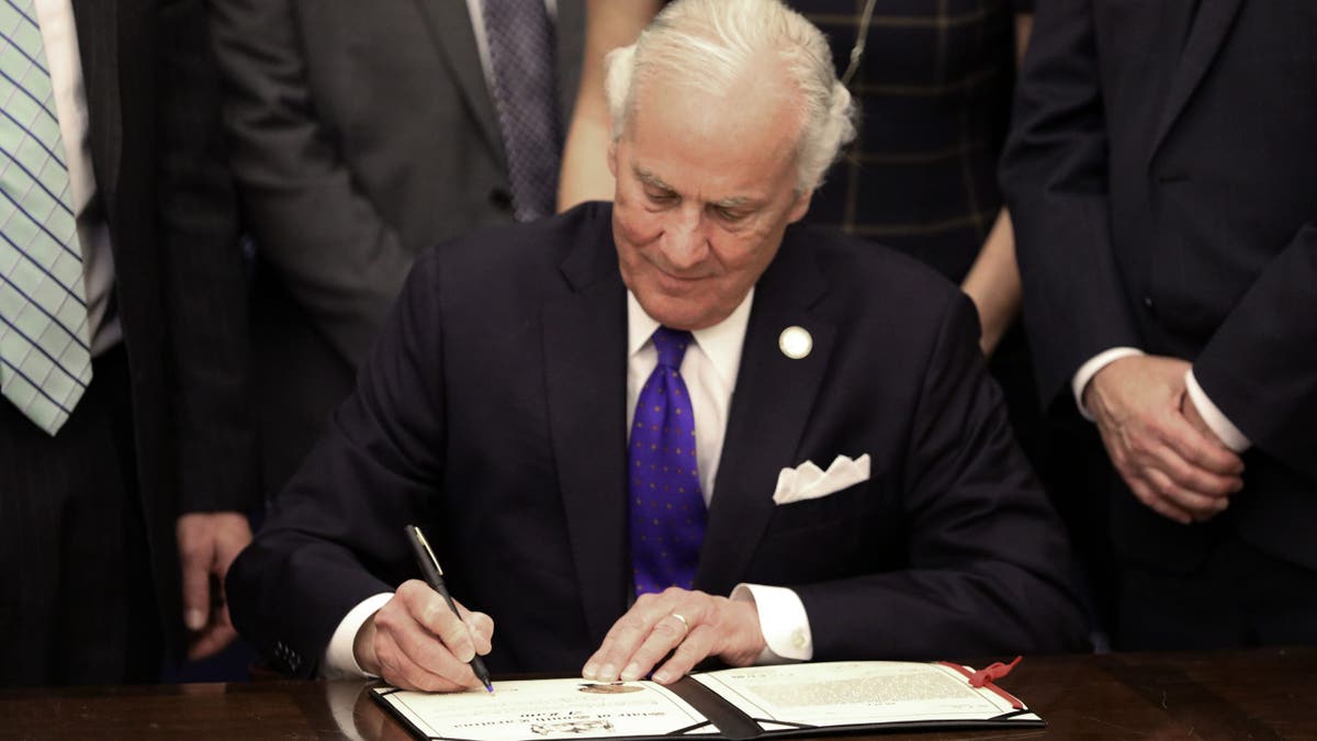 South Carolina Gov. Henry McMaster signing a ceremonial bill in Columbia
