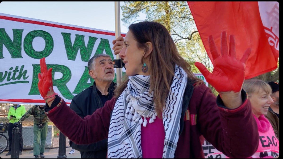A woman protesting the war with Iran.