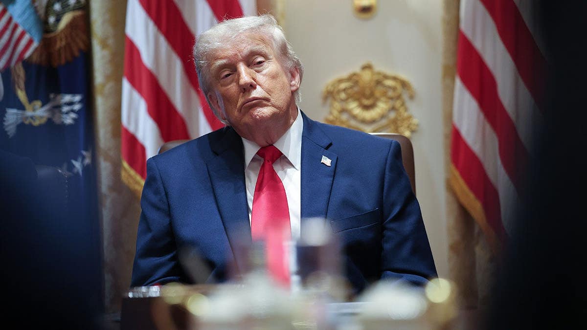 U.S. President Donald Trump listening to Cabinet members in the White House Cabinet Room