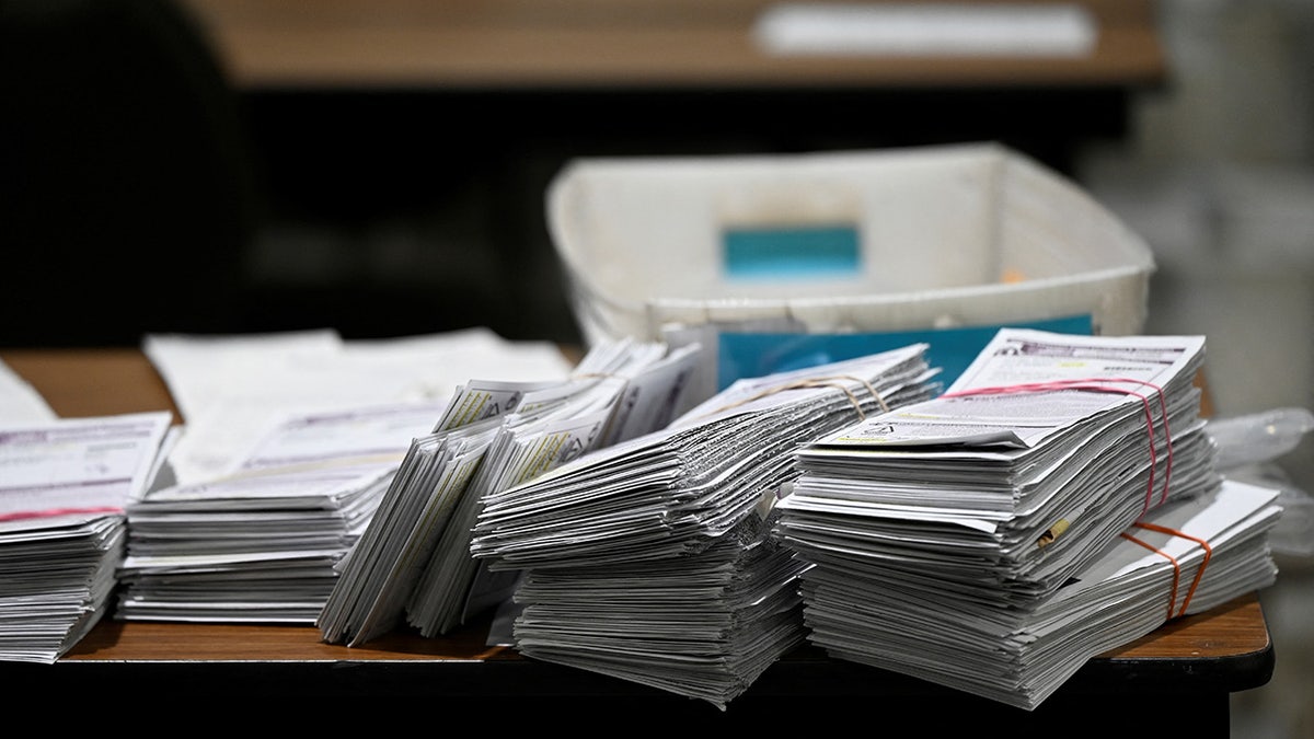 Ballots stacked on a table at the central count in Baird Center in Milwaukee, Wisconsin