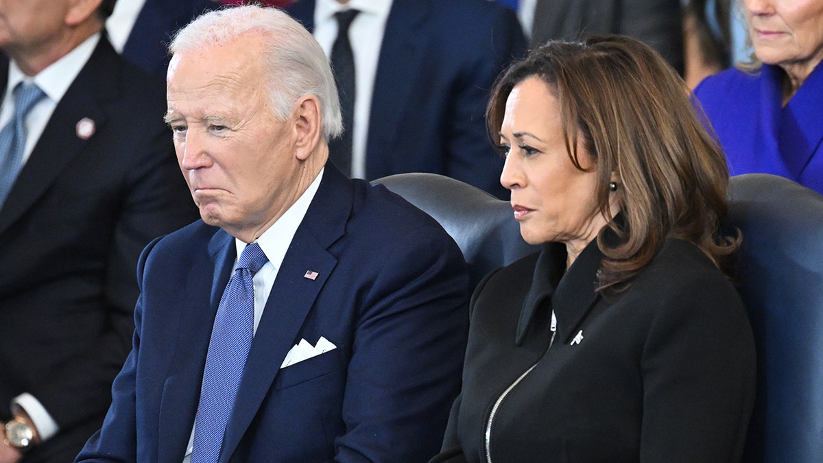 President Joe Biden and Vice President Kamala Harris standing in the U.S. Capitol Rotunda during Donald Trump's inauguration ceremony