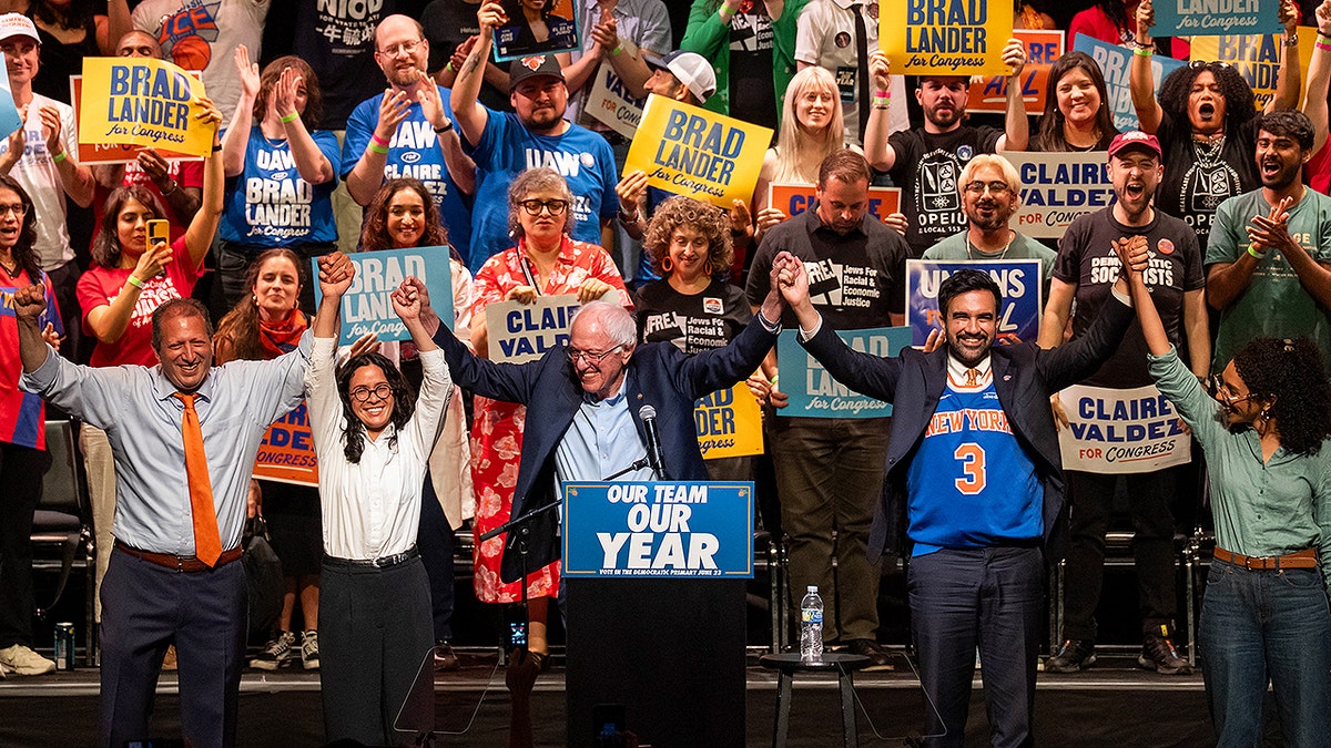 Brad Lander standing with Zohran Mamdani and Bernie Sanders at a rally in Brooklyn