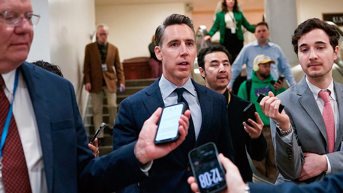 Sen. Josh Hawley speaking to reporters in the Senate subway at the U.S. Capitol