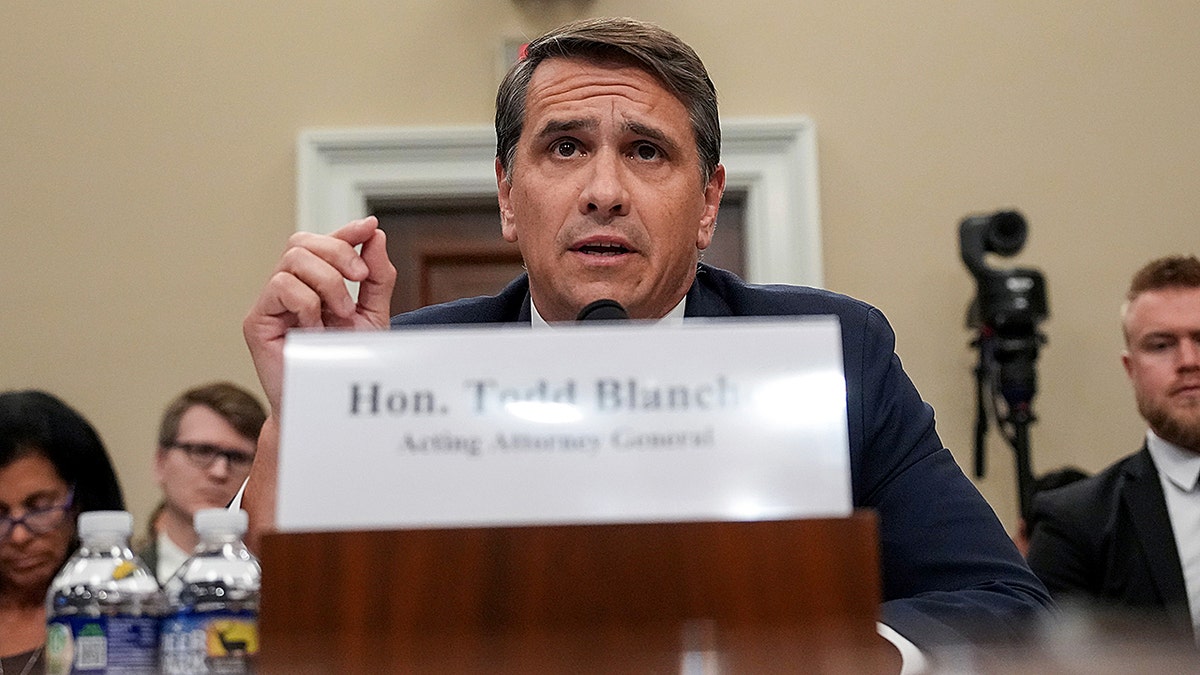 Todd Blanche testifying during a House Committee on Appropriations subcommittee hearing inside a wood-paneled room.