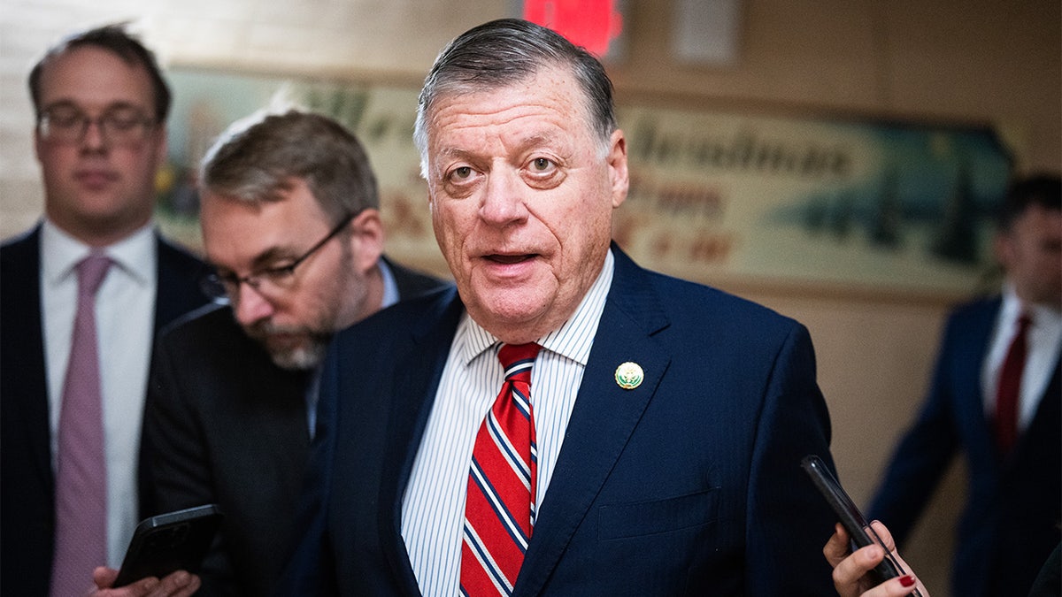 Rep. Tom Cole standing and speaking at a podium.