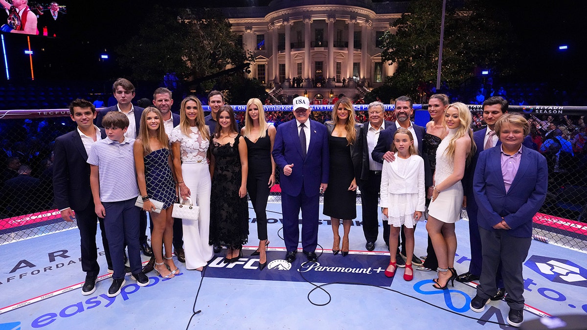 President Donald J. Trump and family posing inside the Octagon at the White House