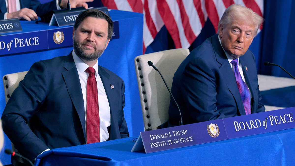 Vice President JD Vance and President Donald Trump standing together at the Donald J. Trump Institute of Peace