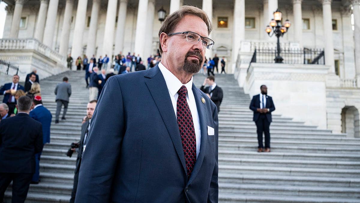 Chuck Edwards walks down Capitol Steps