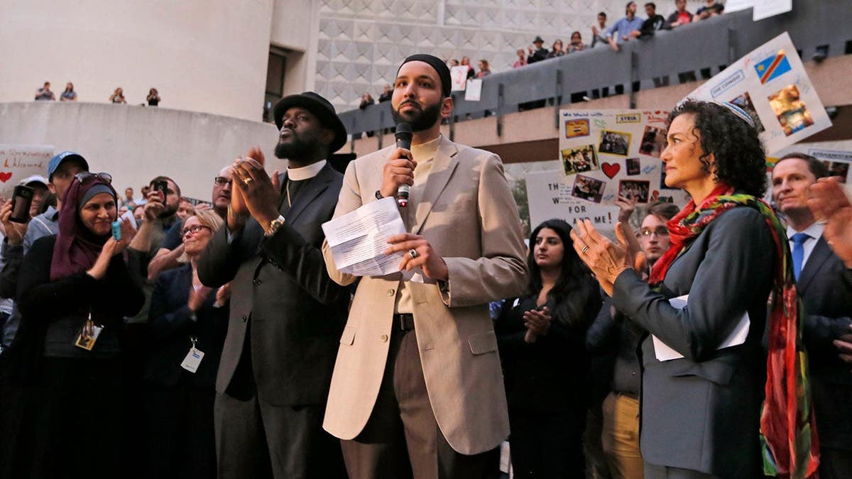 Imam Omar Suleiman speaks at a vigil in Dallas, Texas.
