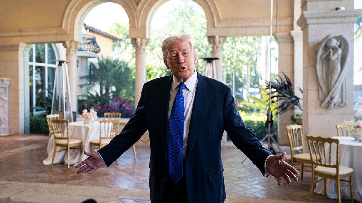 Donald Trump speaks to reporters at Mar-a-Lago.