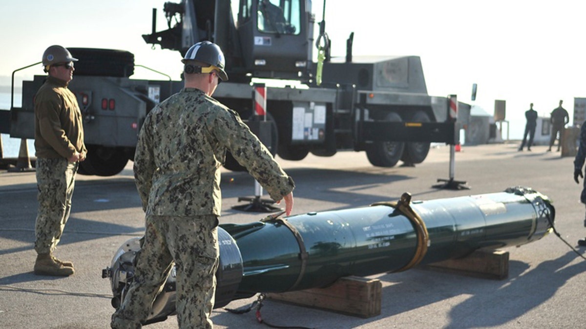 Sailors do a loading exercise.