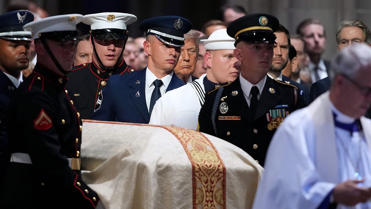 A military team carries the casket of Sen. Lindsey Graham at the Washington National Cathedral on July 28, 2026.