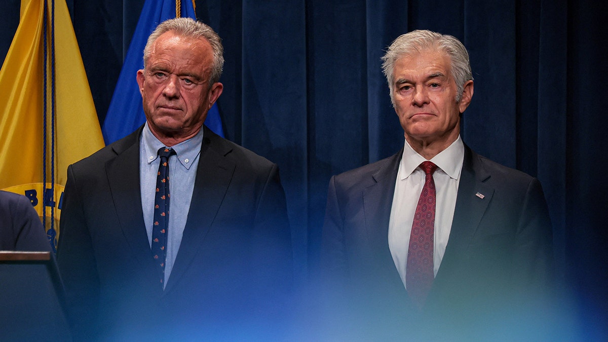 Robert F. Kennedy Jr. standing next to