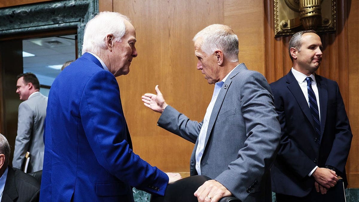 Sen. John Cornyn, R-Texas, talks with Sen. Thom Tillis, R-N.C., during a Senate Finance Committee hearing in the Dirksen Senate Office Building on Capitol Hill on July 30, 2026 in Washington, DC.