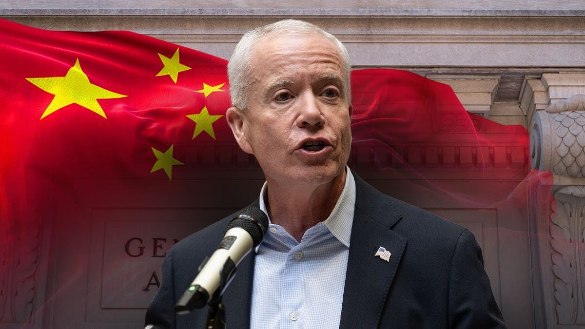 GSA Administrator Edward Forst with a Chinese flag in the background