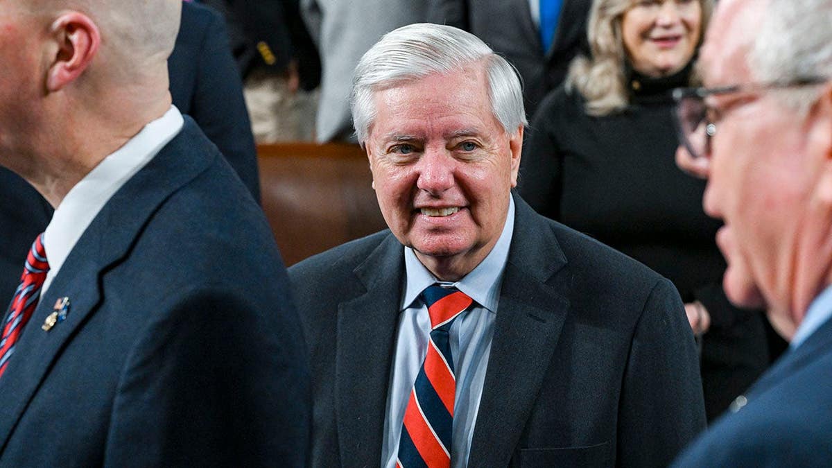 Lindsey Graham walks at the Capitol in Washington, D.C.
