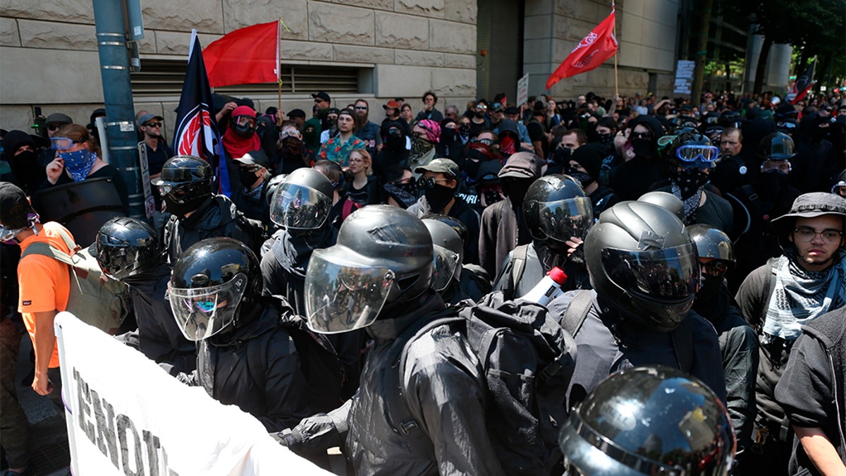 Multiple groups, including Rose City Antifa and the Proud Boys protest in downtown Portland, Ore., Saturday, June 29, 2019. (Dave Killen/The Oregonian via AP)