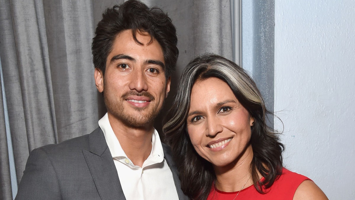 Abraham Williams and Tulsi Gabbard attend an event