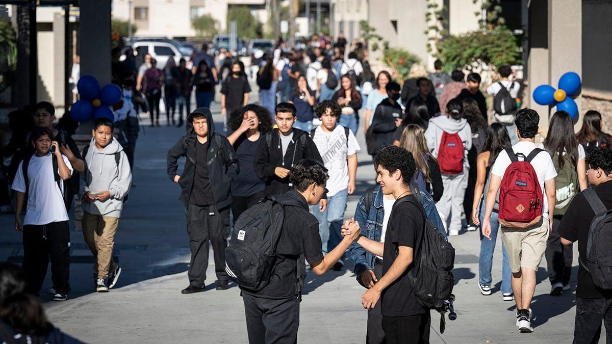 Students head to class at Anaheim High School after summer break.