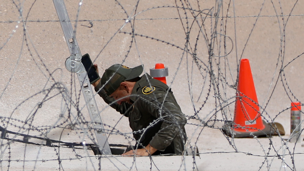 A Border Patrol agent sealing a smuggler tunnel