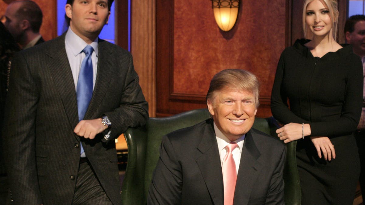 Donald Trump Jr., Donald Trump and Ivanka Trump standing together at the Hollywood Bowl.