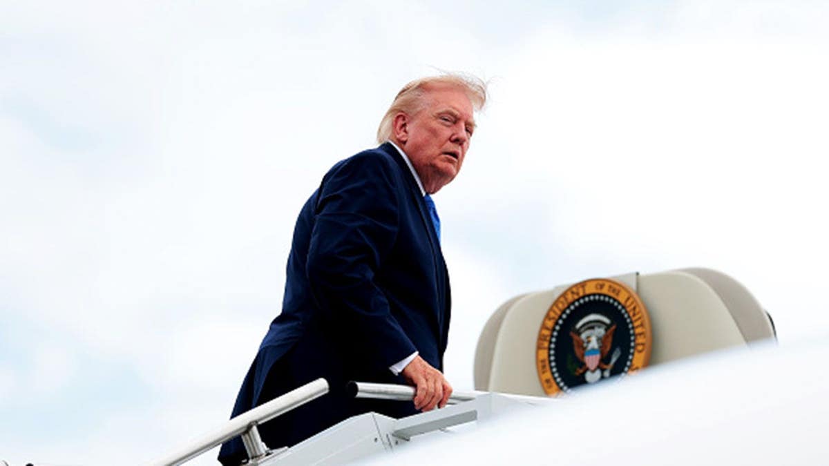 President Donald Trump boards Air Force One at Morristown Municipal Airport on August 2, 2026.